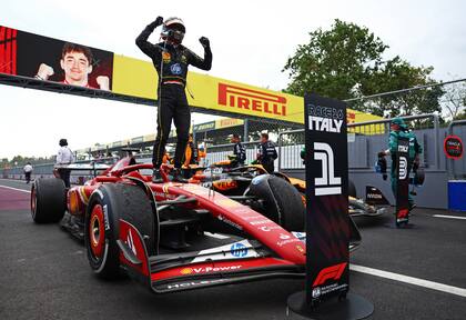 MONZA, ITALY - SEPTEMBER 01: Race winner Charles Leclerc of Monaco and Ferrari celebrates in parc ferme during the F1 Grand Prix of Italy at Autodromo Nazionale Monza on September 01, 2024 in Monza, Italy. (Photo by Bryn Lennon - Formula 1/Formula 1 via Getty Images)