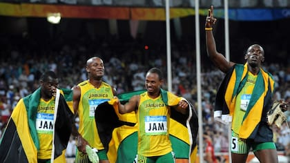 Nesta Carter, Asafa Powell, Michael Frater y Usain Bolt, el equipo que ganó la final de 2008 y acaba de ser despojado de su medalla