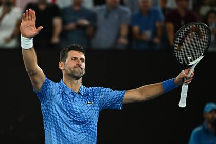 Novak Djokovic of Serbia celebrates after winning his match against Alex de Minaur of Australia during the 2023 Australian Open tennis tournament at Melbourne Park in Melbourne, Monday, January 23, 2023. (AAP Image/Joel Carrett) NO ARCHIVING, EDITORIAL USE ONLY