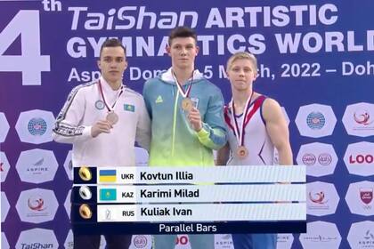 Polémica en el podio de gimnasia en Doha: el ucraniano Kovtun, el kazako Karimiy el ruso Kuliak, con la "Z" en el pecho.