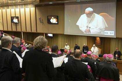 Pope Francis, standing at the bottom second from right, prays at the start of a sex abuse prevention summit, at the Vatican, Thursday, Feb. 21, 2019. The gathering of church leaders from around the globe is taking place amid intense scrutiny of the Catholic Churchs record after new allegations of ab