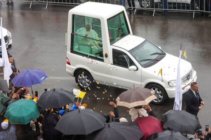 Pope Leo XIV arrives in the popemobile at the tomb of Saint Charbel Makhlouf in Annaya, north of Beirut on December 1, 2025. Pope Leo XIV is set to urge peace and unity on his second day in Lebanon on December 1, 2025, bringing a message of hope to young people whose faith in their crisis-hit country has dwindled. (Photo by AFP)