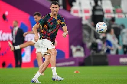 Portugal's Cristiano Ronaldo warms up during the World Cup group H soccer match between South Korea and Portugal, at the Education City Stadium in Al Rayyan, Qatar, Friday, Dec. 2, 2022. (AP Photo/Ariel Schalit)