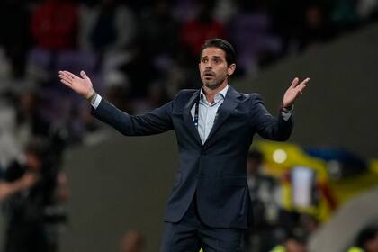 Racing Club's head coach Fernando Gago races during Argentinian Super Cup final between Boca Juniors and Racing Club in Abu Dhabi, United Arab Emirates, Friday, Jan. 20, 2023. (AP Photo/Kamran Jebreili)