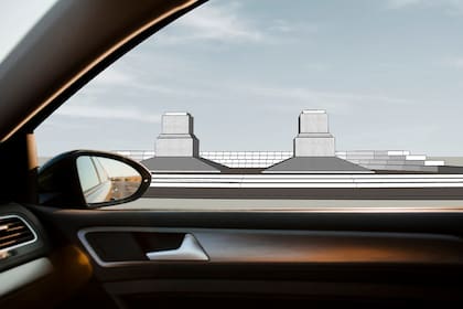 Render de una vista de la plaza de los pedestales vacíos desde un auto; la plaza está ubicada en Las Heras, Mendoza