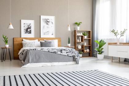 Revestimiento acrílico decorativo de efecto símil piedra color marfil.