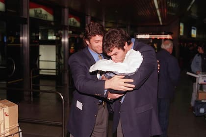 Rubén Capria y Nacho González, que conoció a su hijo en Ezeiza por la gira que Racing hizo por Japón en 1996