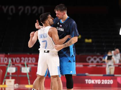 SAITAMA, JAPAN - JULY 26: Luka Doncic #77 of Team Slovenia embraces Facundo Campazzo #7 of Team Argentina after the team's win against Argentina during the second half on day three of the Tokyo 2020 Olympic Games at Saitama Super Arena on July 26, 2021 in Saitama, Japan. (Photo by Gregory Shamus/Getty Images)