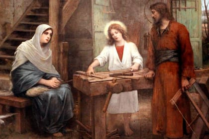 San José Obrero enseñándole a Jesús el oficio de carpintero junto a la Virgen María