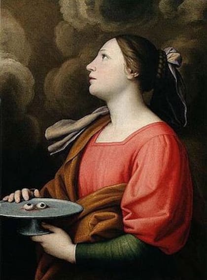 Santa Lucía es una mártir puesto que murió torturada en las persecuciones a los católicos en el Imperio Romano durante el siglo III