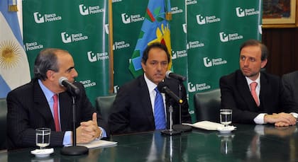 Guillermo Francos, a la izquierda, en una conferencia de prensa junto a Daniel Scioli y Gustavo Marangoni