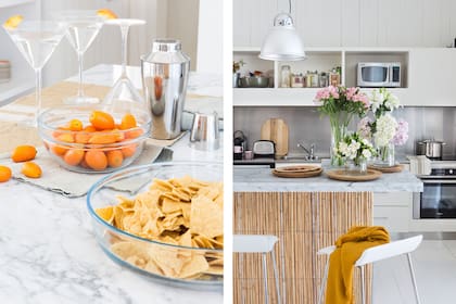 Tanto la mesada como la alzada son de acero inoxidable con bacha integrada (Estudio Martín Gómez). Sobre la barra, platos de madera (Marabierto), plantas aromáticas y jarrones con flores (ambos de Casa Castilla).