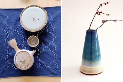 Teteras y cuenco de Marilú Fernández sobre individual bordado a mano con la técnica tradicional del sashiko. Florero de gres de Pau Nerome, ceramista nikkei