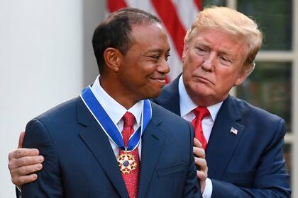 Tiger Woods y Donald Trump, en una imagen de archivo.