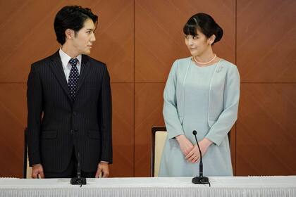 TOKYO, JAPAN - OCTOBER 26: Princess Mako, the elder daughter of Prince Akishino and Princess Kiko, and her husband Kei Komuro, a university friend of Princess Mako, poses during a press conference to announce their wedding at Grand Arc Hotel on October 26, 2021 in Tokyo, Japan. Princess Mako married Kei Komuro today at a registry office following a relationship beset with controversy following the revelation that Mr Komuro’s mother was embroiled in a financial dispute with a former fiancé. Following the wedding, Mako will renounce her royal entitlements and move with Komuro to New York. (Photo by Nicolas Datiche - Pool/Getty Images)