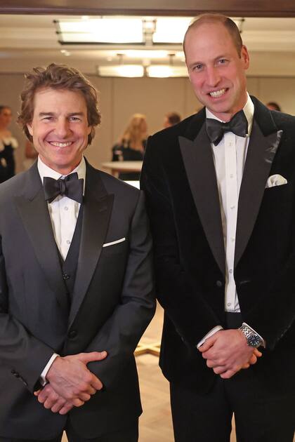 Tom y el príncipe William durante la gala solidaria celebrada en el Hotel Raffles la semana pasada.