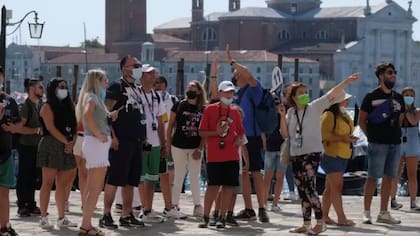 Turistas en la plaza de San Marcos en Venecia, cuyas autoridades quieren cobrar una entrada de 10 euros por persona para entrar en la ciudad.