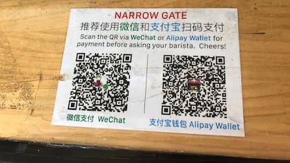 Un cartel de pago para WeChat y AliPay en China