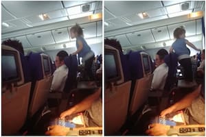 Filmó a una niña mientras saltaba en la mesa plegable del avión y el padre sorprendió con su reacción