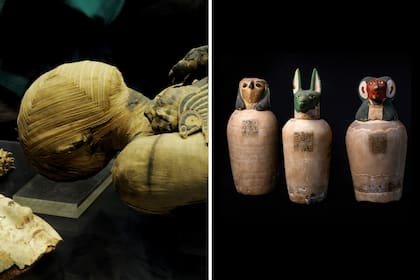 Una persona momificada junto a frascos canopos, utilizados para albergar los organos del fallecido