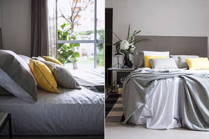 Una propuesta masculina con ropa de cama en diferentes tonos de gris. Abajo, la alfombra rayada encuadra el área. Sobre la mesa de luz, una lámpara y un gatito negro facetado