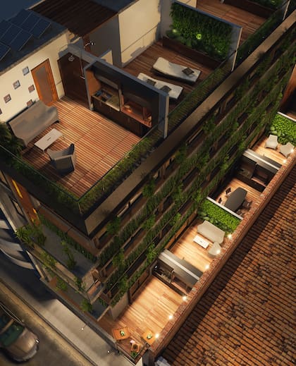 Vista de un edificio de PHs en la ciudad de Buenos Aires con terraza y jardines verticales