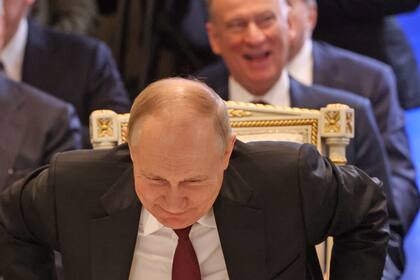 YEREVAN, ARMENIA - NOVEMBER 23: (RUSSIA OUT) Russian President Vladimir Putin (C) smiles as Defense Minister Sergei Shoigu (L) and Security Council Secretary Nikolay Patrushev (R) look on during the SCTO Summit, on November 23, 2022 in Yerevan, Armenia. Leaders of Russia, Armenia, Belarus, Kazakhstan, Kyrgyzstan and Tajikistan have arrived to Yerevan to participate in the Summit of CSTO (Collective Security Treaty Organisation). (Photo by Contributor/Getty Images)