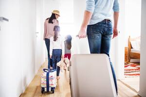Young family with two children going on a holiday.