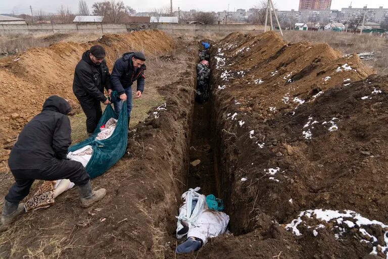 The bodies were laid to rest in a mass grave on Wednesday, March 9, 2022, in the suburbs of the Ukrainian city of Mariupol, where Russian troops could not bury the dead.