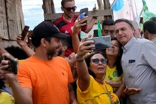 President Jair Bolsonaro with supporters in Nova Jerusalem.  (AP Photo/Eraldo Perez)