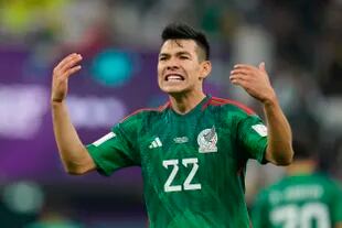 Mexico's Hirving Lozano celebrates after Henry Martin scored a goal during the World Cup group C soccer match between Saudi Arabia and Mexico, at the Lusail Stadium in Lusail, Qatar, Wednesday, Nov. 30, 2022. (AP Photo/Julio Cortez)