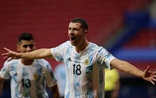 Argentina's Guido Rodriguez celebrates after scoring his side's opening goal against Uruguay during a Copa America soccer match at the National Stadium in Brasilia Brazil, Friday, June 18, 2021. (AP Photo/Eraldo Peres)