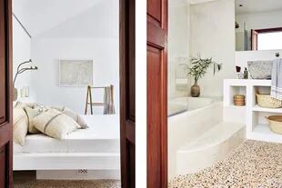 El baño tiene un mueble de obra con estantes abiertos, bacha de piedra y bañadera con una delicada terminación de revoque (Moredesign).